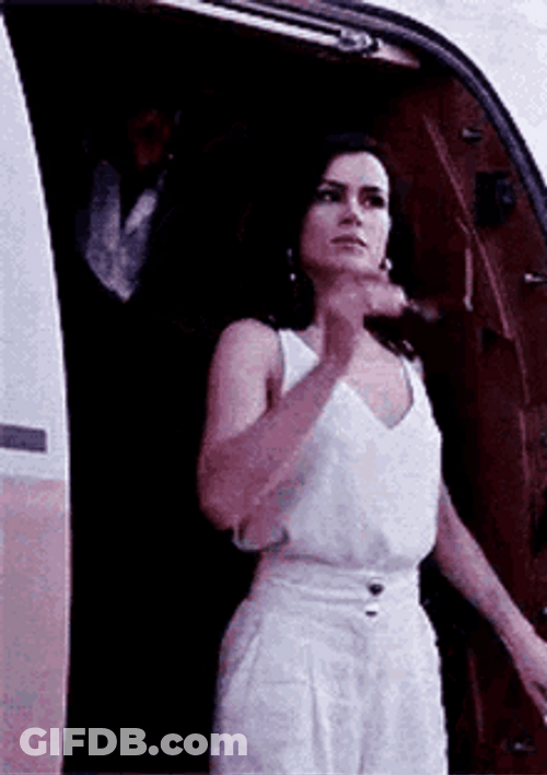 365 Days Laura Biel Getting Off Plane Wear Sunglasses GIF