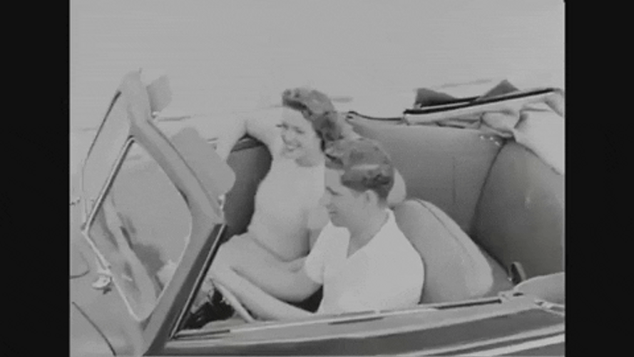 40S Couple Riding Together GIF