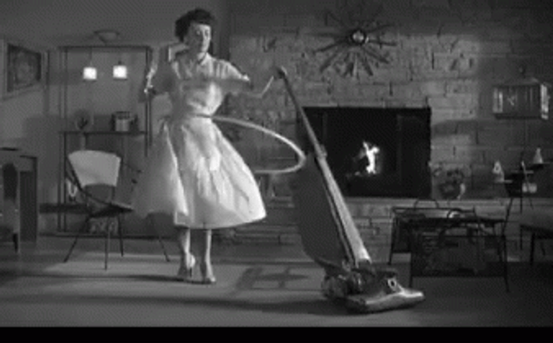 80S Lady Cleaning While Doing Holla Hoop GIF