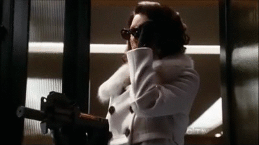 80S Lady Taking Off Sunglasses GIF