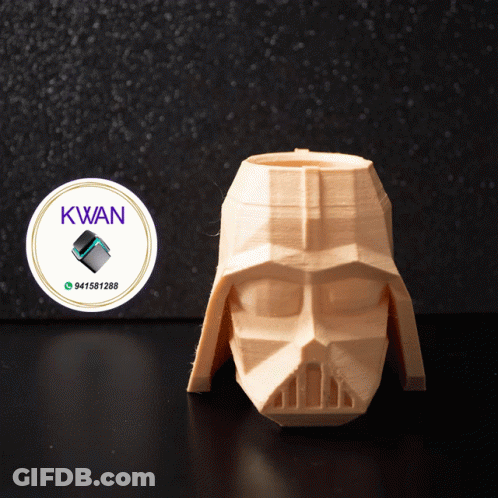 A 3D Printed Darth Vader Head With A Kwan Logo On It GIF