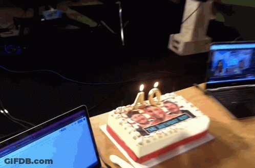 A 40Th Birthday Cake With Two Candles On It GIF