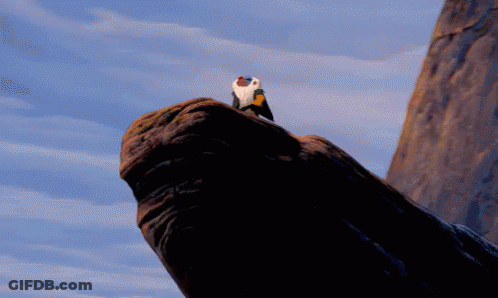 A Baboon Is Holding A Baby Lion In His Arms In A Cartoon GIF