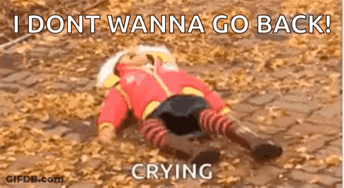 A Baby Doll Is Laying On The Ground With A Caption That Says `` I Dont Wanna Go Back ! '' GIF