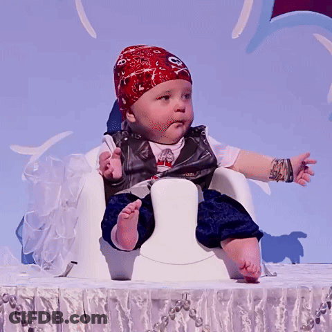 A Baby Dressed As A Pirate With A Bandana On His Head GIF