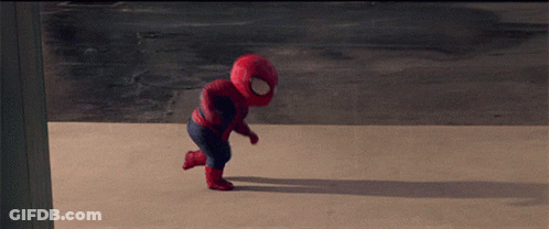 A Baby Dressed In A Spiderman Costume Is Running GIF