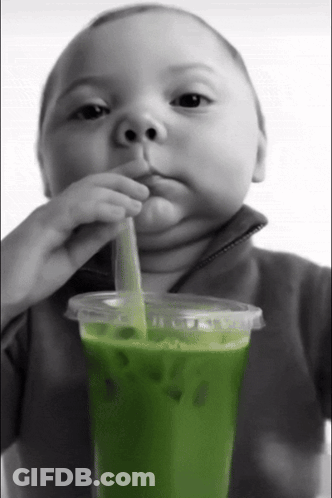 Baby Drinks Green Smoothie Through Straw GIF