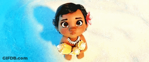 A Baby From The Movie Moana Is Sitting On The Beach Holding A Sea Shell . GIF