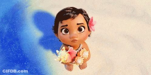 A Baby From The Movie Moana Is Standing On The Beach Holding A Seashell And A Flower . GIF