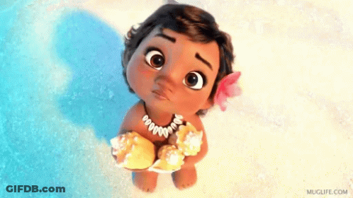 A Baby Girl From The Movie Moana Is Holding A Seashell In Her Hands . GIF