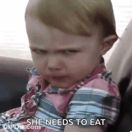 A Baby Girl Is Crying While Sitting In A Car Seat And Says `` She Needs To Eat '' . GIF