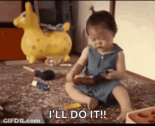 A Baby Girl Is Sitting On The Floor Playing With Toys And Saying `` I 'Ll Do It '' . GIF