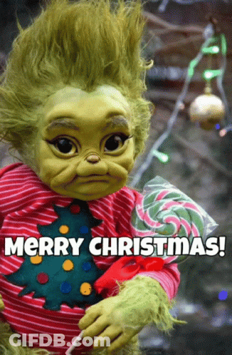 A Baby Grinch Holding A Lollipop With The Words Merry Christmas Below GIF