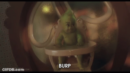 A Baby Grinch Is Sitting In A High Chair With The Words Burp Below Him GIF