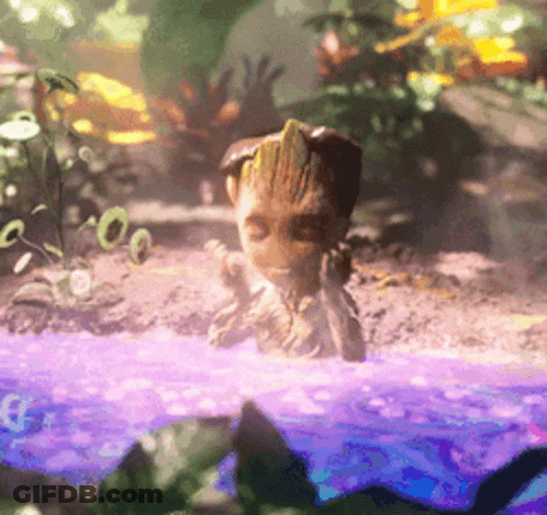 A Baby Groot From Guardians Of The Galaxy Is Swimming In A Pool Of Water GIF