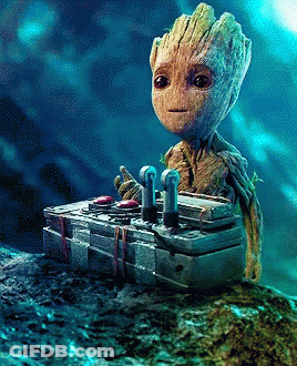 Baby Groot Sitting On Pile Of Boxes GIF