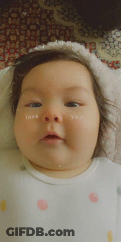 A Baby Has The Words Love You Written On Her Face GIF