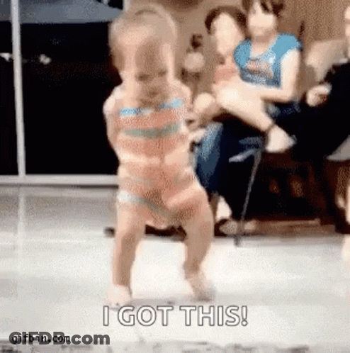 A Baby In A Bikini Is Dancing In Front Of A Crowd . GIF