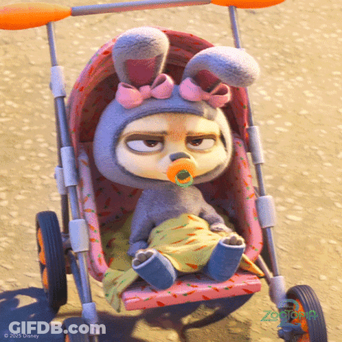 A Baby In A Bunny Costume Is Sitting In A Stroller With A Pacifier In Her Mouth GIF