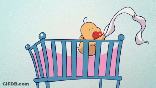A Baby In A Crib With A Pacifier In Its Mouth GIF