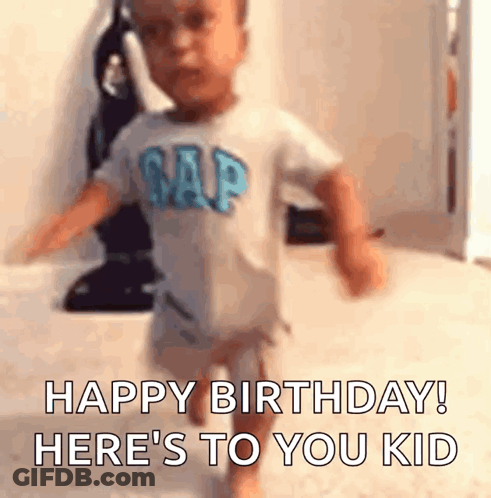 A Baby In A Gap Shirt Is Running In A Room And Saying `` Happy Birthday ! Here 'S To You Kid '' . GIF