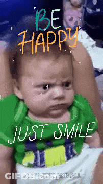 Baby In Green Shirt Says Be Happy Smile GIF