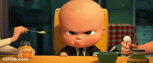 A Baby In A High Chair Is Being Fed By A Woman With A Spoon GIF