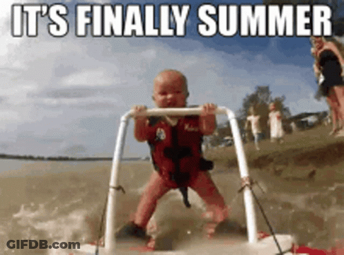 A Baby In A Life Jacket Is Standing On A Raft In The Water With The Words It 'S Finally Summer Behind Him GIF