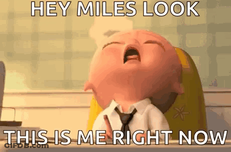 A Baby In A Suit And Tie Is Crying With The Words `` Hey Miles Look This Is Me Right Now '' Written On It . GIF