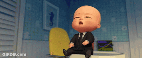 A Baby In A Suit And Tie Is Sitting On A Toilet And Crying GIF