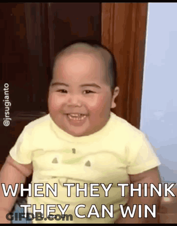 A Baby In A Yellow Shirt Is Smiling And Says When They Think They Can Win . GIF