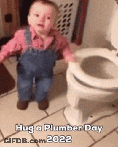 A Baby In Overalls Is Standing Next To A Toilet And Says Hug A Plumber Day 2022 GIF