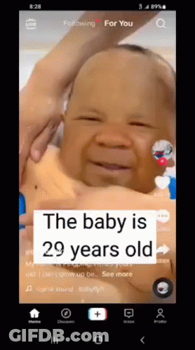 A Baby Is 29 Years Old And Is Being Held In Someone 'S Arms GIF
