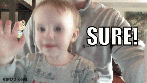 A Baby Is Being Held By A Man Who Is Wearing A Shirt That Says " Sure " GIF