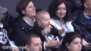 A Baby Is Being Held By A Woman In A Pittsburgh Penguins Shirt GIF