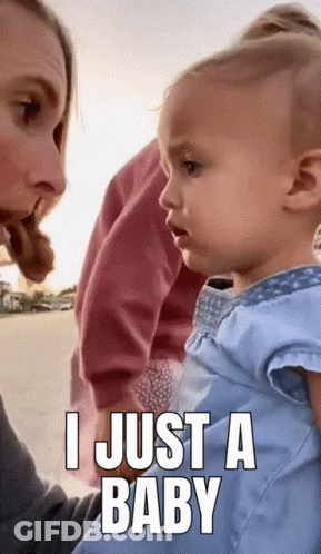 A Baby Is Being Held By A Woman With A Caption That Says I Just A Baby GIF