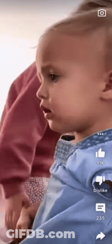 A Baby Is Being Held In Someone 'S Arms With The Number 235 On The Bottom GIF