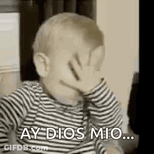 A Baby Is Covering His Face With His Hand And Saying `` Ay Dios Mio '' . GIF