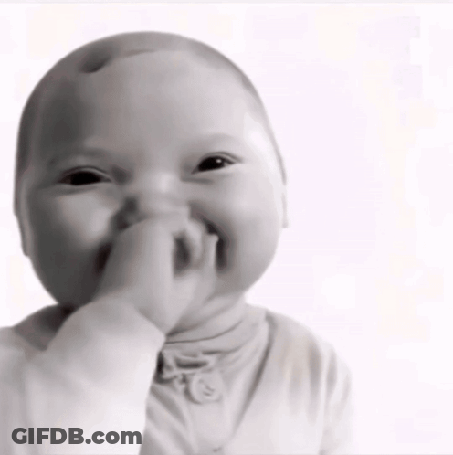 A Baby Is Covering His Mouth With His Hand GIF
