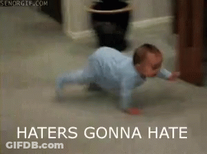 A Baby Is Crawling On The Floor With The Words Haters Gonna Hate Above Him GIF