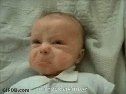 A Baby Is Crying And Saying `` It 'S Your Birthday '' While Laying On A Blanket . GIF