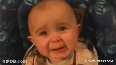 A Baby Is Crying In A High Chair . GIF