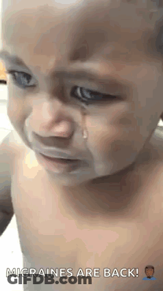 A Baby Is Crying With A Tear Coming Out Of His Eyes . GIF