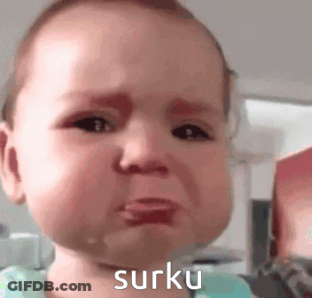 A Baby Is Crying With The Word Surku Written On The Bottom Of His Face . GIF