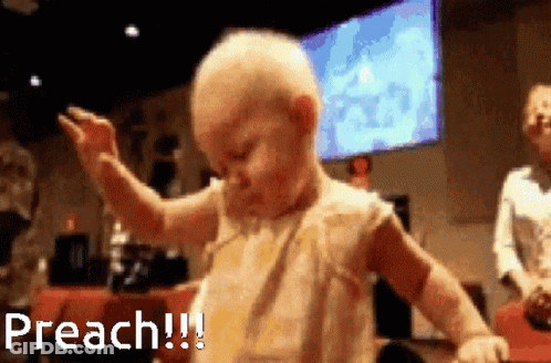 A Baby Is Dancing In Front Of A Large Screen That Says Preach GIF