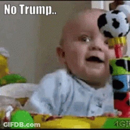A Baby Is Holding A Stuffed Soccer Ball On Top Of A Stack Of Blocks With The Caption " No Trump " Above It GIF