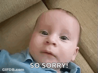 A Baby Is Laying On A Couch And Making A Funny Face And Saying `` So Sorry '' . GIF