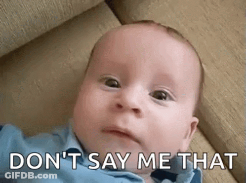 A Baby Is Laying On A Couch And Making A Funny Face With The Words `` Don T Say Me That '' . GIF