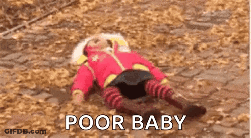 A Baby Is Laying On The Ground With The Words `` Poor Baby '' Written Above Him . GIF