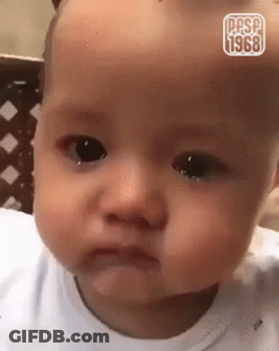 A Baby Is Making A Funny Face And Has The Year 1968 On It GIF